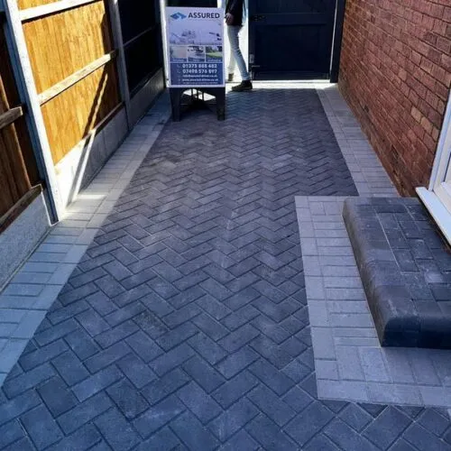 front charcoal block paved driveway side entrance 05