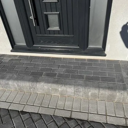 front charcoal block paved driveway side entrance 44